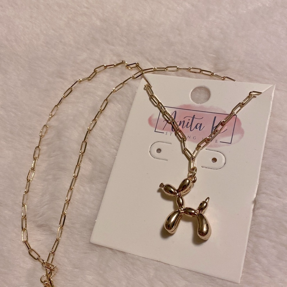 Paperclip chain with Balloon dog gold pendant.